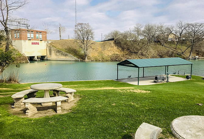 river side park with picnic table and covered patio