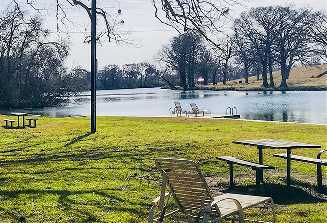 riverside park with outdoor tables